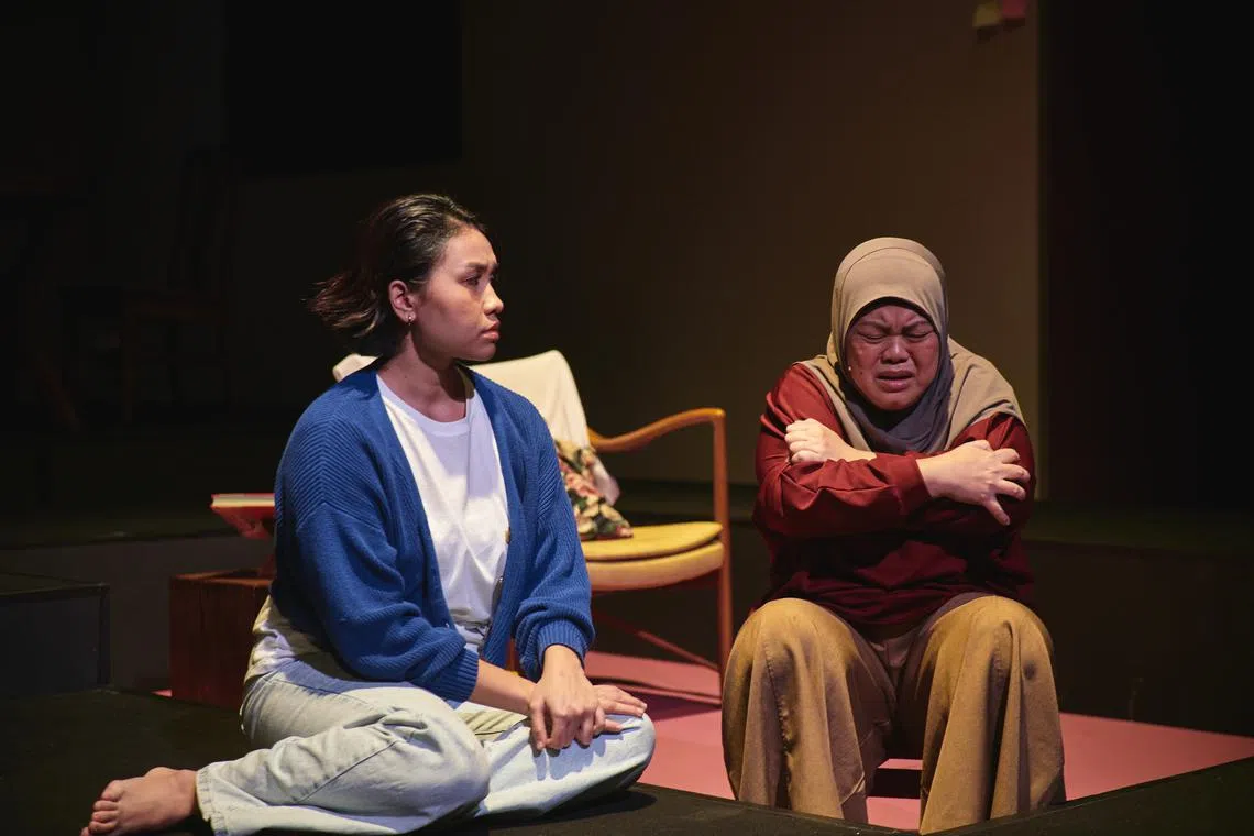 Farah Lola (left) plays Hanna, a single daughter who faces expectations of caring for her mother (Dalifah Shahri) in playwright Raimi Safari's Oo-woo. 