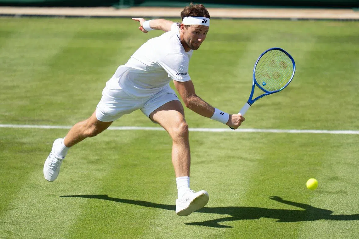 FILE PHOTO: Jun 29, 2026; London, United Kingdom;  Casper Ruud of Norway returns a shot during his match against Hubert Hurkacz of Poland  on day one at All England Lawn Tennis and Croquet Club. Mandatory Credit: Susan Mullane-Imagn Images/File Photo
