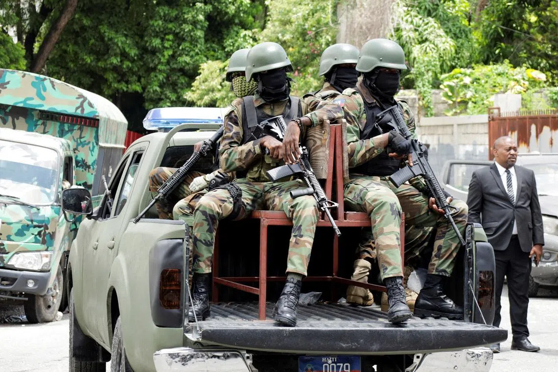 FILE PHOTO: Haitian soldiers keep a watch outside the venue where businessman Laurent Saint-Cyr is set to be designated as president of Haiti's Transitional Presidential Council (CPT), in Port-au-Prince, Haiti, August 7, 2025. REUTERS/Fildor Pq Egeder/File Photo