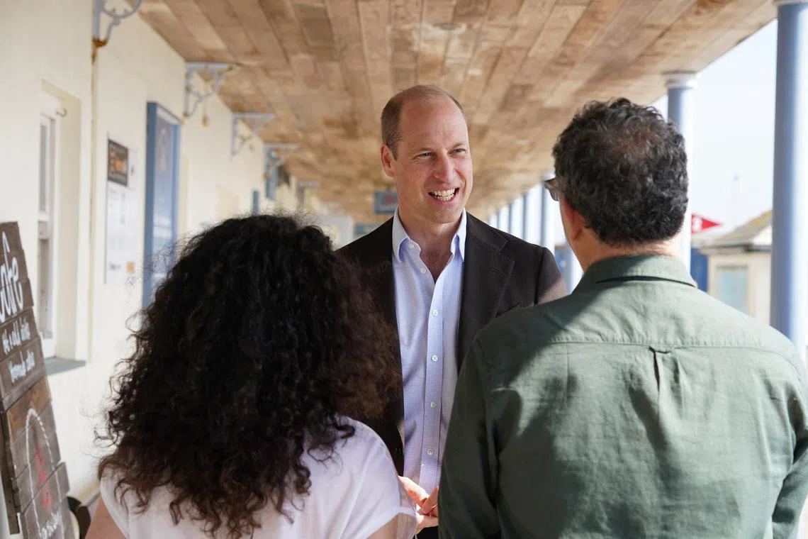 FILE PHOTO: Britain's Prince William, Prince of Wales, known as the Duke of Cornwall when in Cornwall, reacts during a visit to St. Mary's Harbour, the maritime gateway to the Isles of Scilly, to meet representatives from local businesses operating in the area, Isles of Scilly, May 10, 2024. Ben Birchall/Pool via REUTERS/File Photo