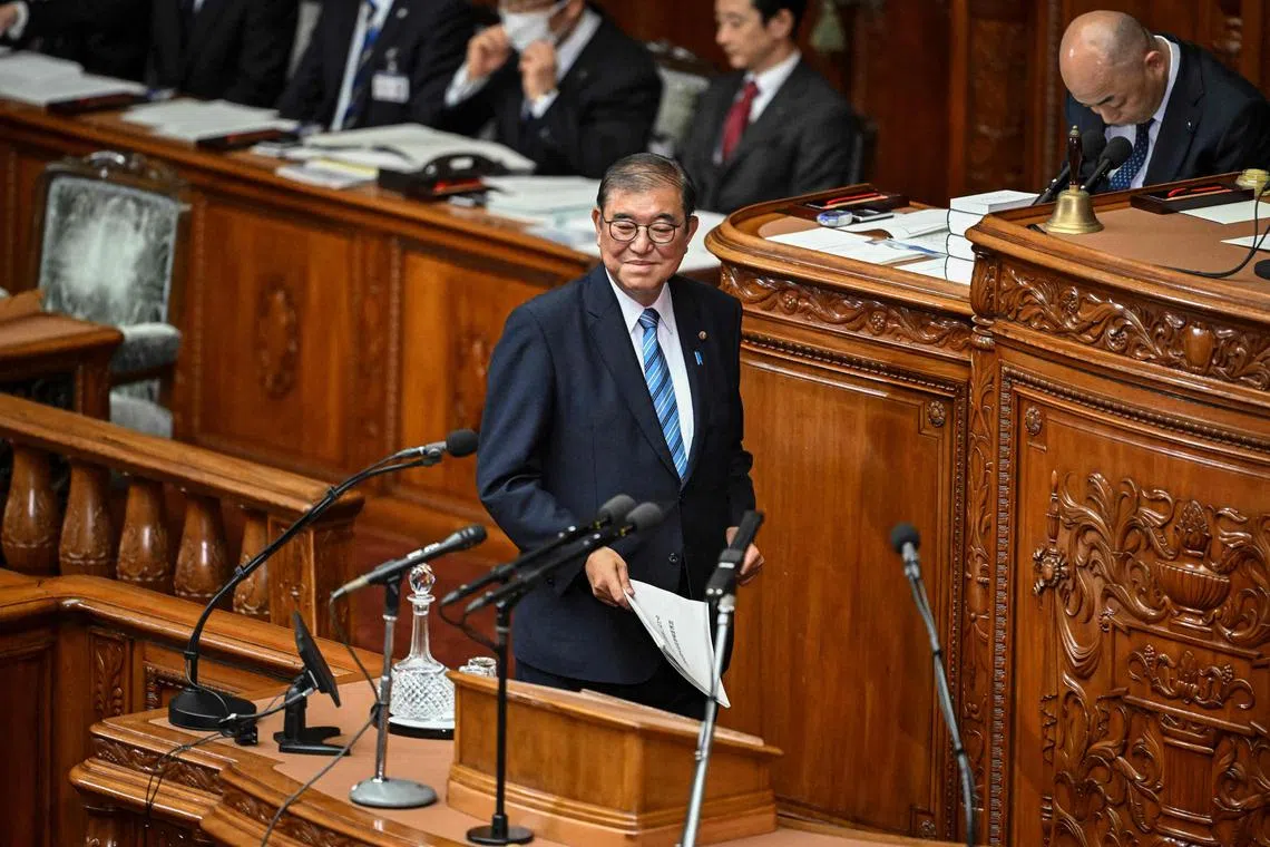 Japan's Prime Minister Shigeru Ishiba arrives to deliver a policy address during a plenary session of the Japanese National Diet's lower house in Tokyo on November 29, 2024. Japan's prime minister said on November 29 he will have "frank discussions" with US president-elect Donald Trump, saying that cooperation between was vital to ensuring a "free and open Pacific". (Photo by Yuichi YAMAZAKI / AFP)