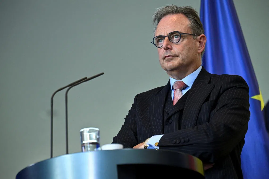 Belgian Prime Minister Bart De Wever attends a press conference with German Chancellor Friedrich Merz (not pictured), at the Chancellery, in Berlin, Germany August 26, 2025. REUTERS/Annegret Hilse