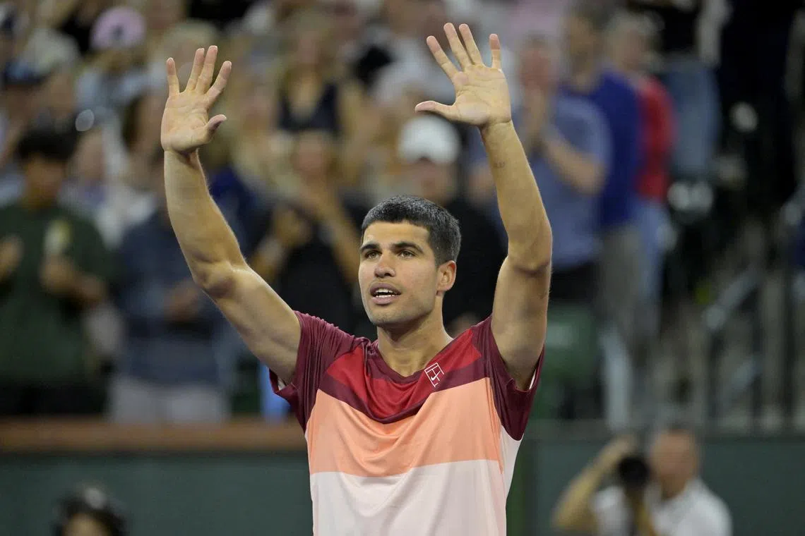 Carlos Alcaraz celebrates after defeating Denis Shapovalov in the third round at Indian Wells.