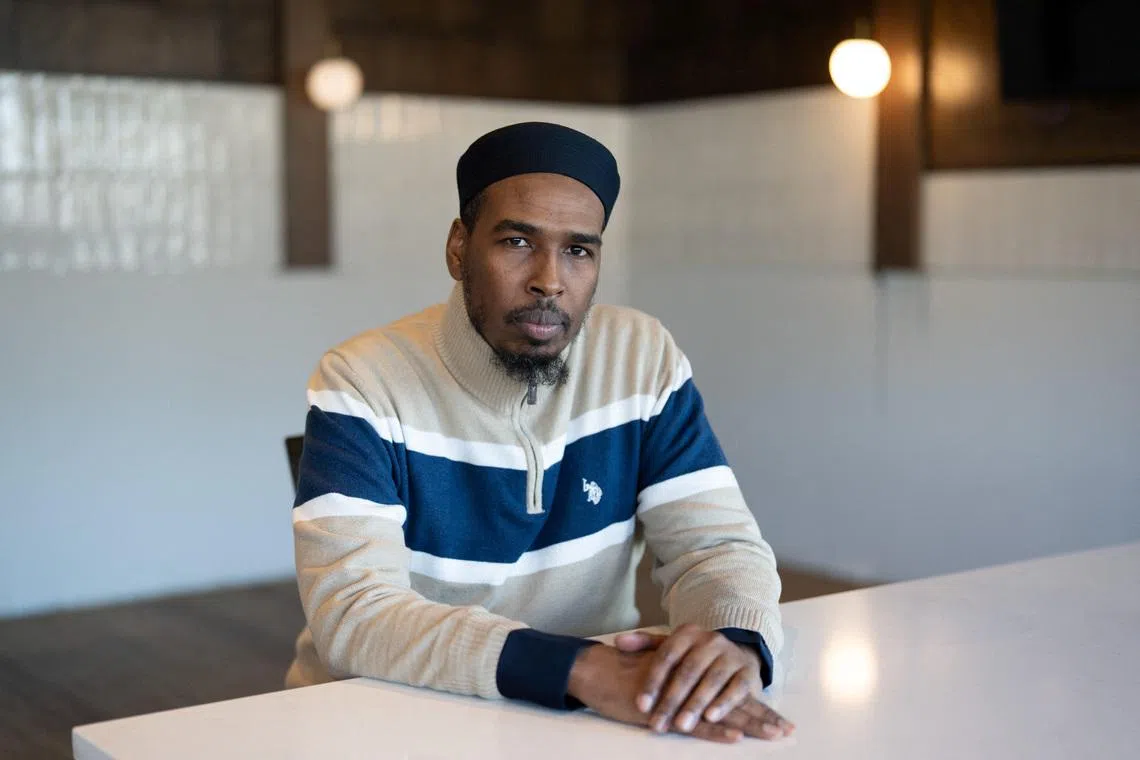 Abdulahi Farah, Chair of the Somali-American Leadership Table-MN (SALT) and a father leader, sits for a portrait, days after an ICE agent fatally shot Good, in Bloomington, Minnesota, U.S., January 14, 2026.   REUTERS/Tim Evans