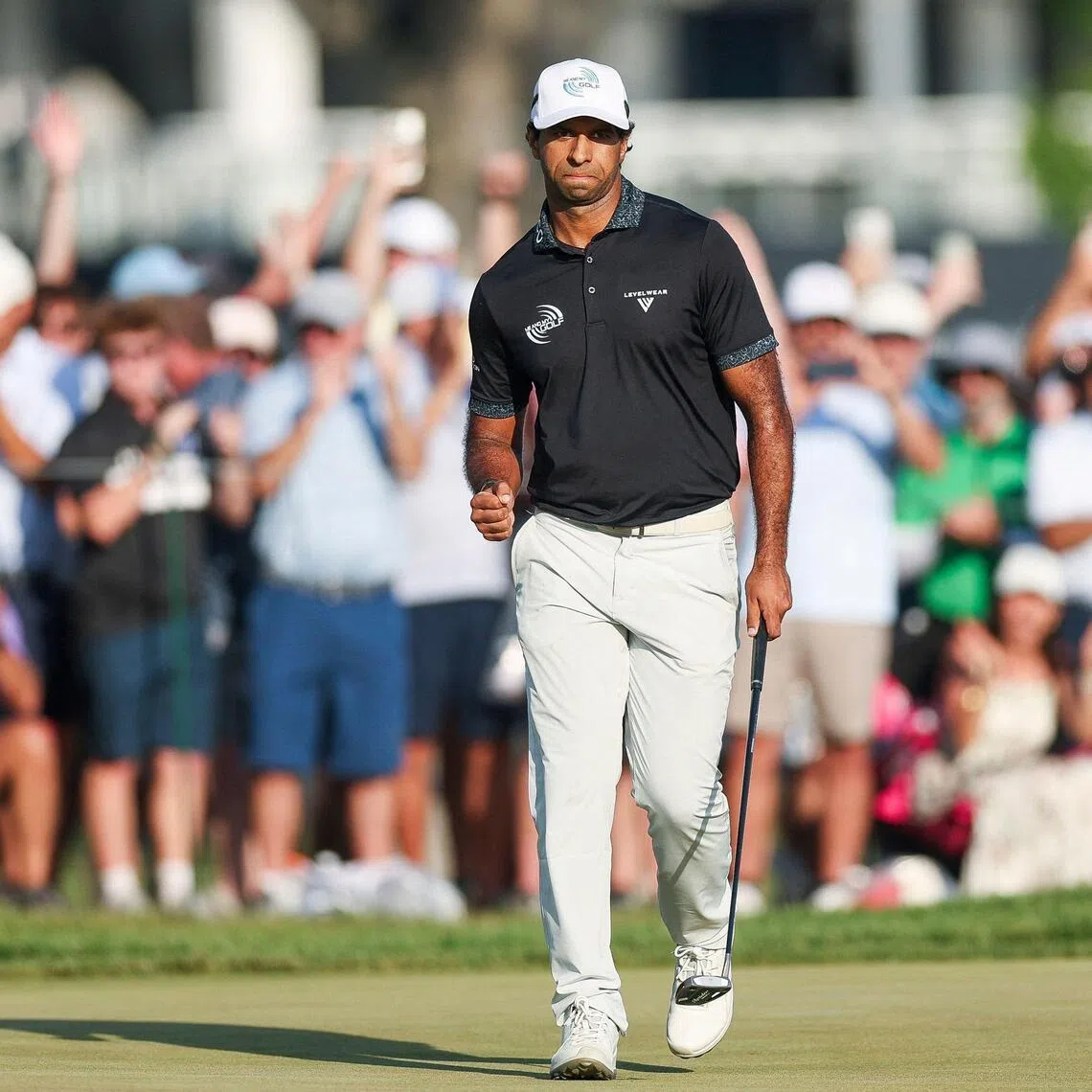 Aaron Rai of England celebrates after a putt on the 17th green during the final round of the PGA Championship at Aronimink Golf Club.