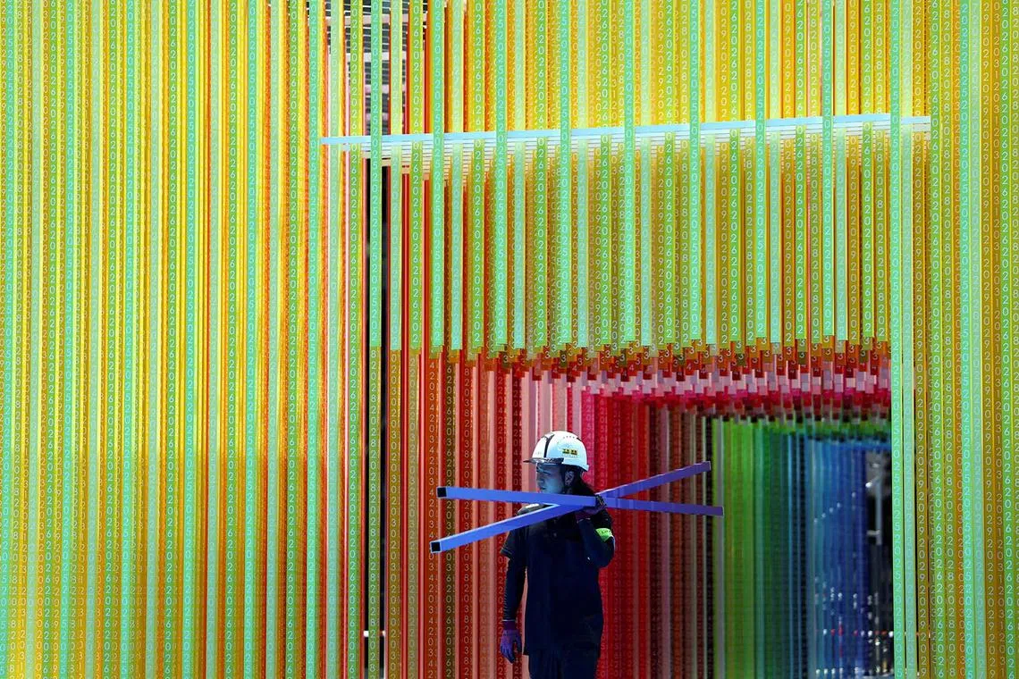 A man working under an art installation, as the Japanese government issued a heatstroke alert in Tokyo and other prefectures, in Tokyo, Japan, July 22, 2025. 