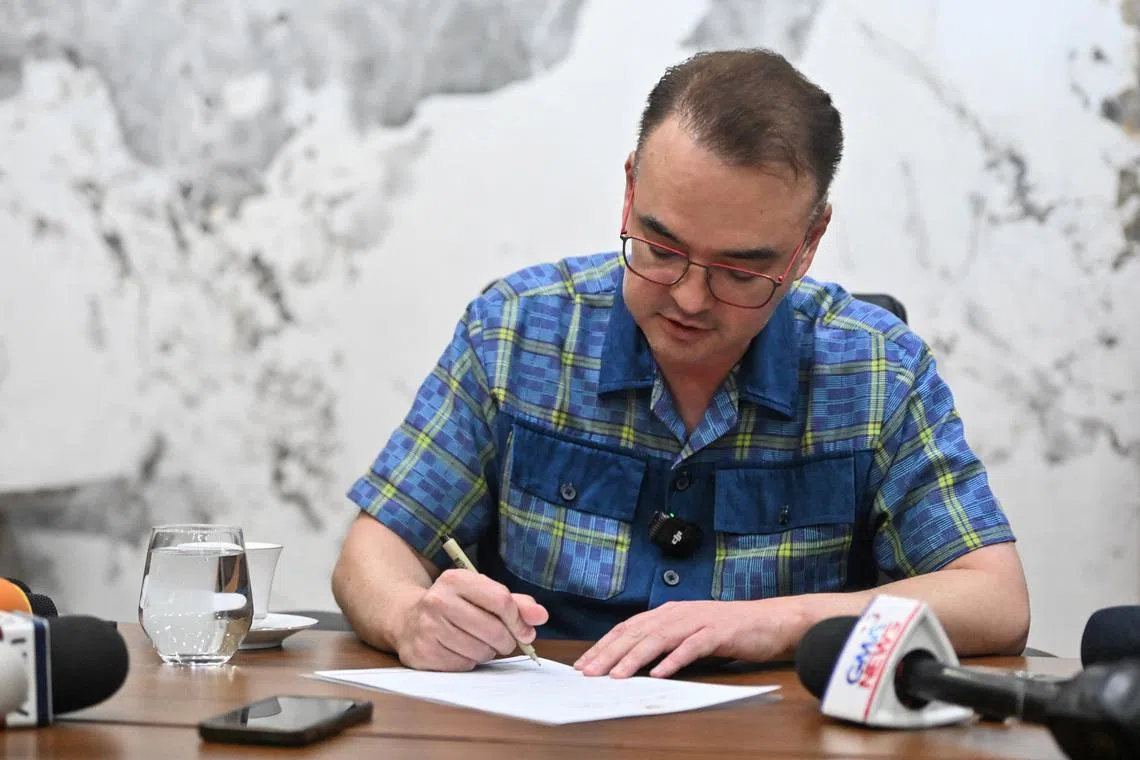 Philippine Senate President Alan Peter Cayetano signs the confirmation letter of the Articles of Impeachment against Vice President Sara Duterte at the Philippine Senate, in Pasay City, Metro Manila, Philippines, May 14, 2026. REUTERS/Noel Celis