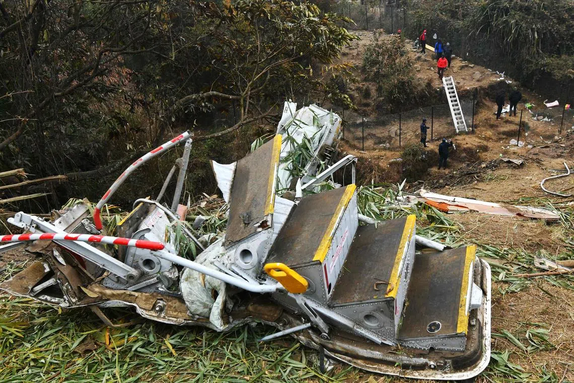 Rescuers inspect the wreckage at the site of a Yeti Airlines plane crash in Pokhara, Nepal, Jan 16, 2023. 