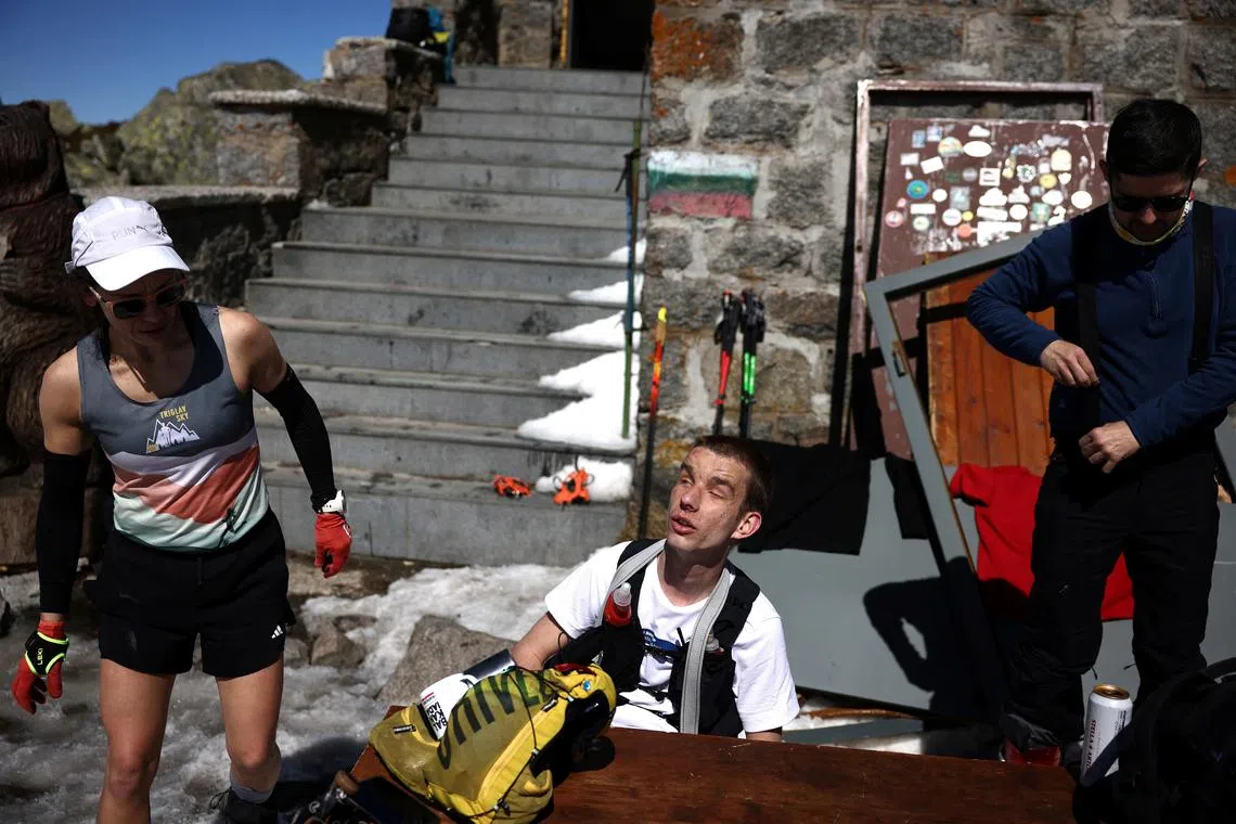 Victor Asenov, a visually impaired ultramarathon runner takes a rest as he attempts to cover the same elevation as Mount Everest, near Sofia, Bulgaria, on March 21.