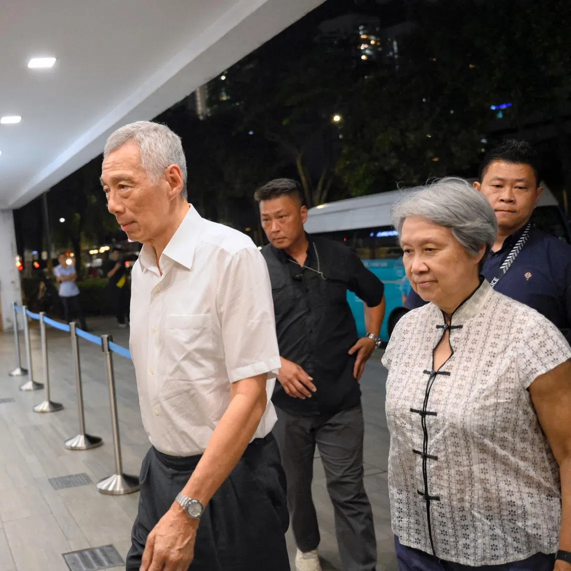 Senior Minister Lee Hsien Loong (left) and his wife Ho Ching arrive at Singapore Casket on Oct 10,.