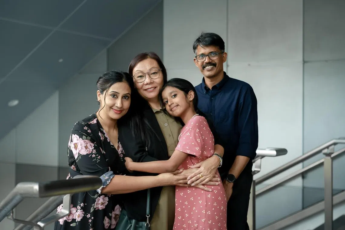 Migrant domestic worker Rana Mamta (second from left) with her employers Joseph Harison, wife Leens Joseph and their daughter Serene Mary Harison, 8, at the Migrant Domestic Worker and Employer Appreciation Day.