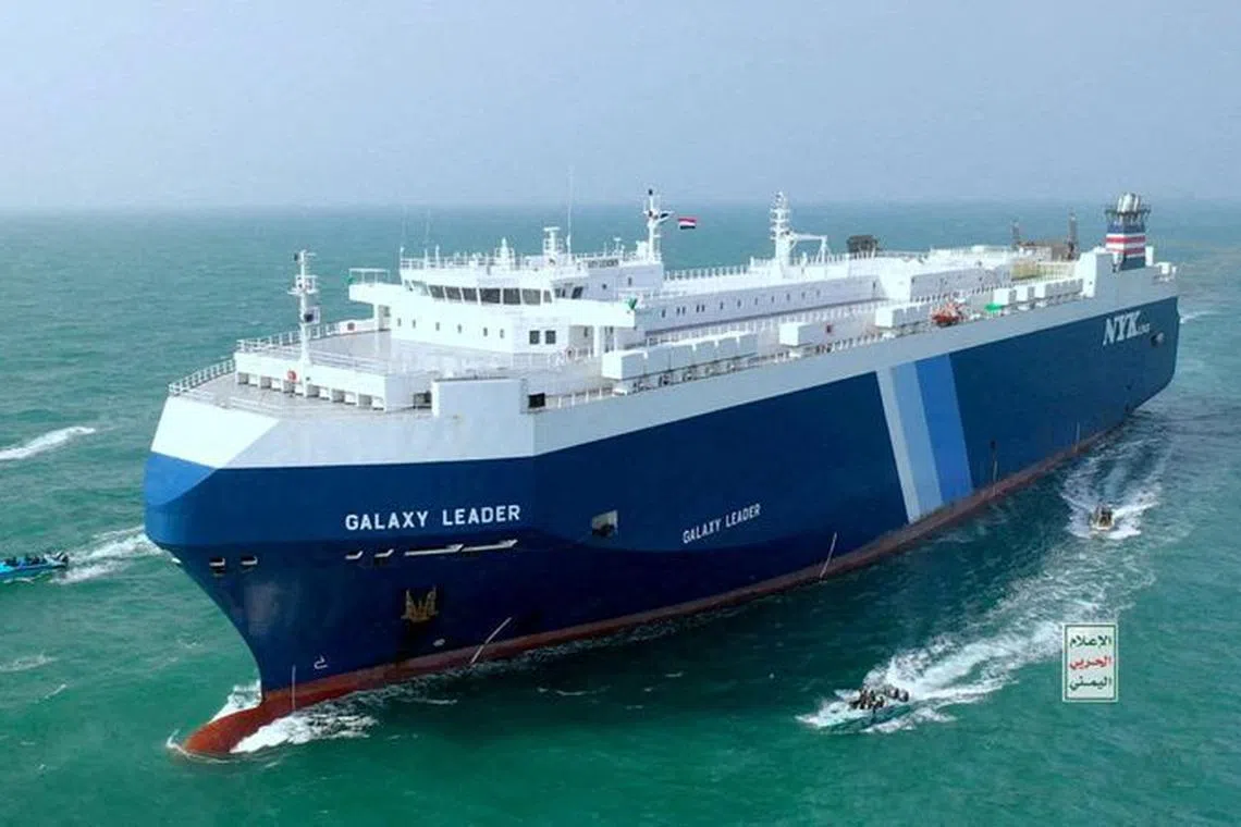 FILE PHOTO: The Galaxy Leader cargo ship is escorted by Houthi boats in the Red Sea in this photo released November 20, 2023. Houthi Military Media/Handout via REUTERS/File Photo