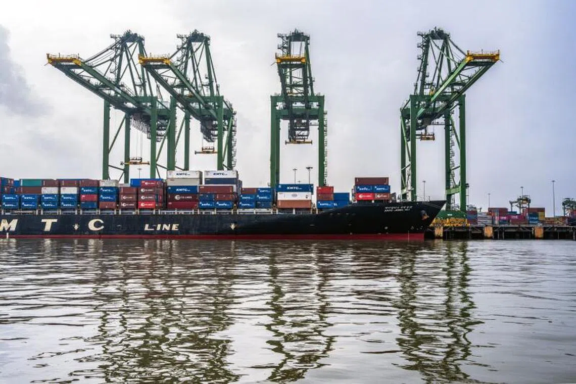 Shipping containers stacked on the KMTC Jebel Ali container ship at Jawaharlal Nehru Port in Navi Mumbai, Maharashtra, India.