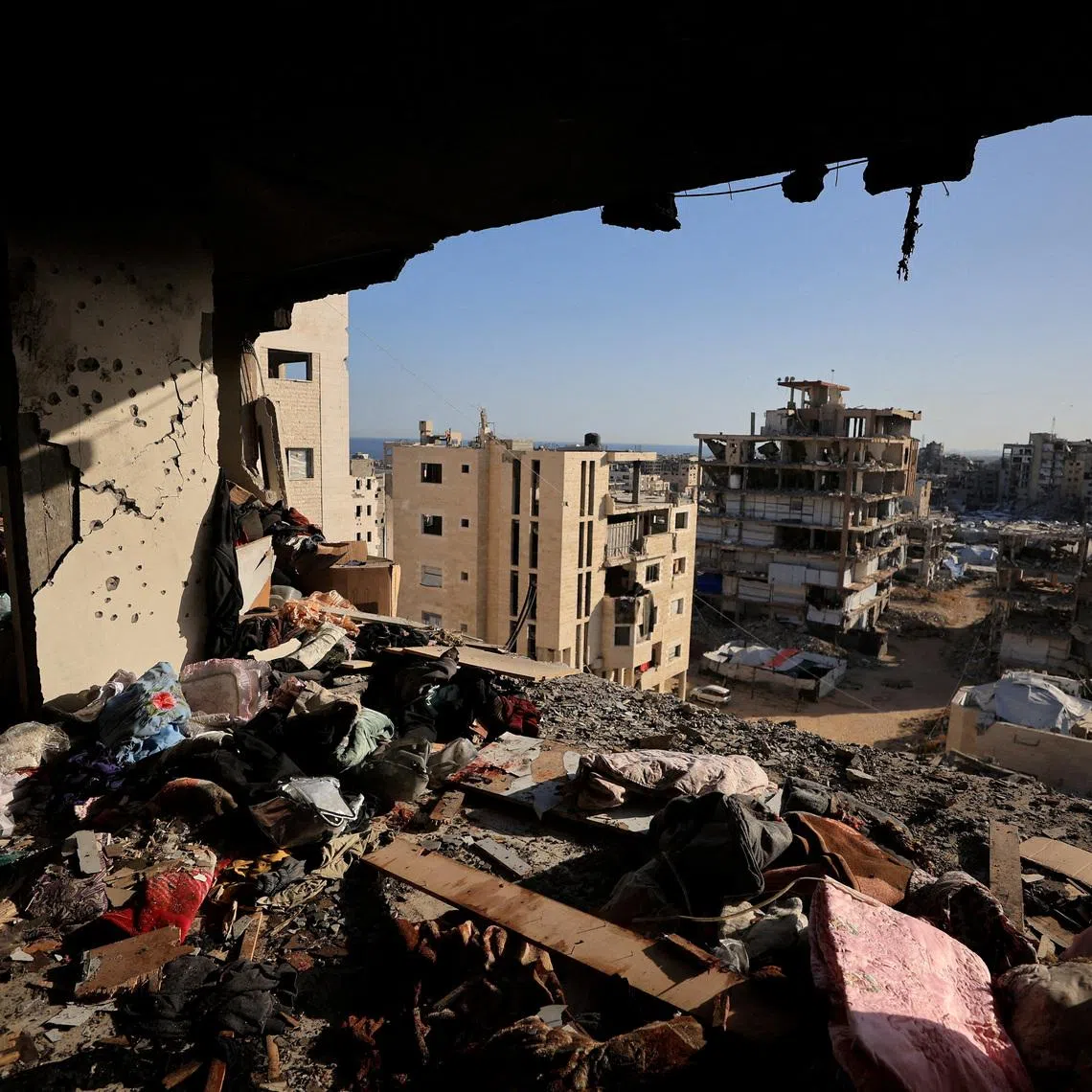 FILE PHOTO: People's belongings lie scattered at the site of an Israeli strike on an apartment building in Gaza City, June 4, 2026. REUTERS/Dawoud Abu Alkas/File Photo