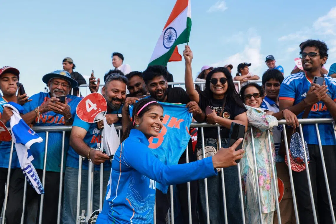 India’s Shreyanka Patil poses with supporters after their victory in the women’s gold-medal cricket match between India and Sri Lanka on Sept 22.