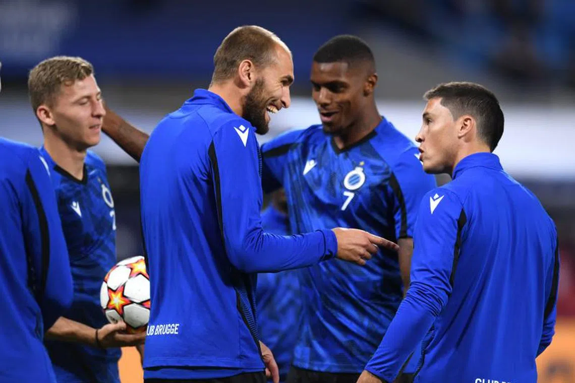Soccer Football - Champions League - Group A - RB Leipzig v Club Brugge - Red Bull Arena, Leipzig, Germany - September 28, 2021 Club Brugge's Bas Dost with teammates during the warm up before the match REUTERS/Annegret Hilse/File photo