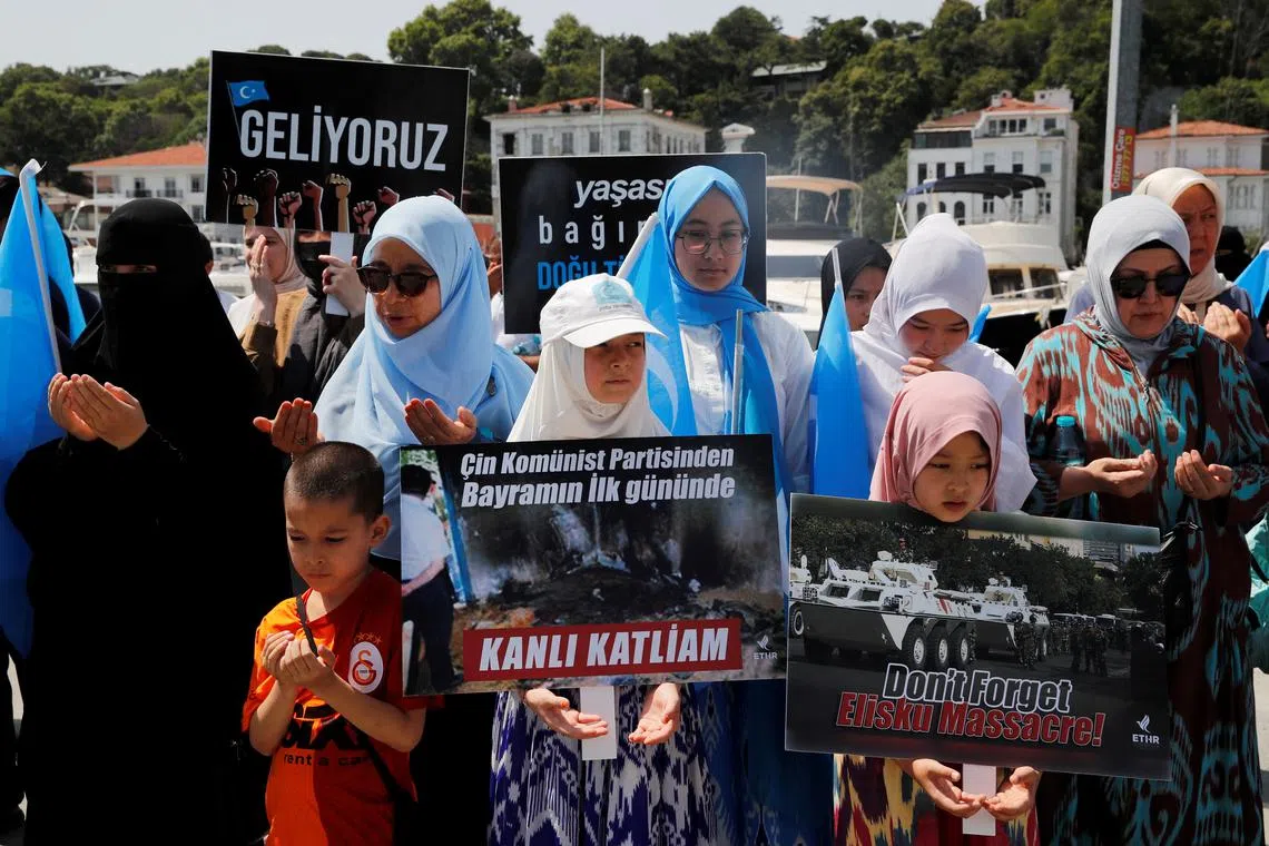 Ethnic Uyghur demonstrators take part in a protest against the visit of Chinese Foreign Minister Wang Yi to the Turkish capital, near the Chinese consulate in Istanbul, Turkey July 26, 2023. REUTERS/Dilara Senkaya/ File Photo