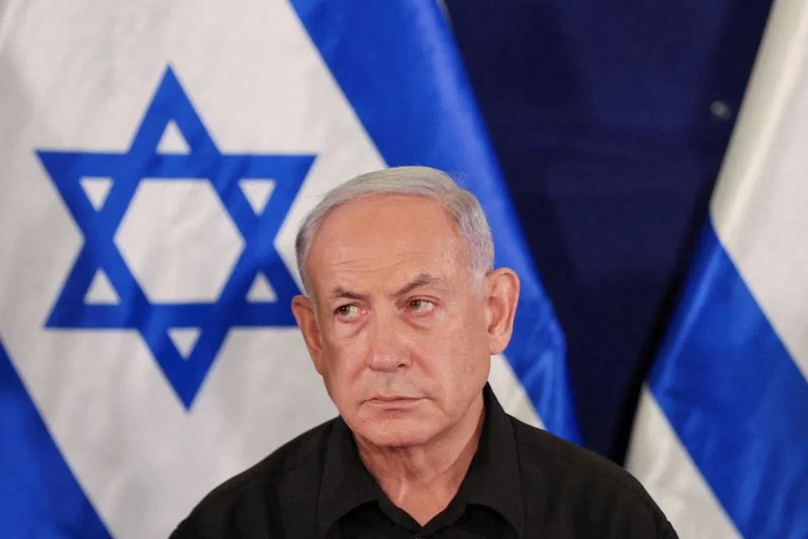 FILE PHOTO: Israeli prime minister Benjamin Netanyahu during a press conference with defense minister Yoav Gallant and Cabinet minister Benny Gantz  in the Kirya military base in Tel Aviv , Israel , 28 October  2023.    ABIR SULTAN POOL/Pool via REUTERS/File Photo