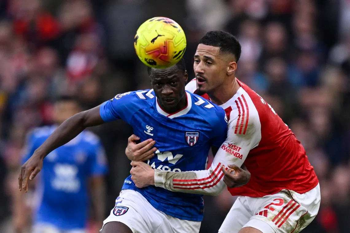 Soccer Football - Premier League - Arsenal v Sunderland - Emirates Stadium, London, Britain - February 7, 2026 Arsenal's William Saliba in action with Sunderland's Habib Diarra REUTERS/Tony O Brien