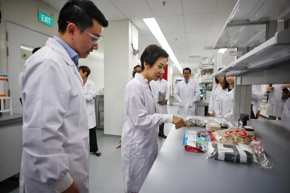 Minister for Sustainability and the Environment Grace Fu (centre) at the opening of the Singapore Food Agency’s relocated National Centre for Food Science in Jurong East on Oct 27.