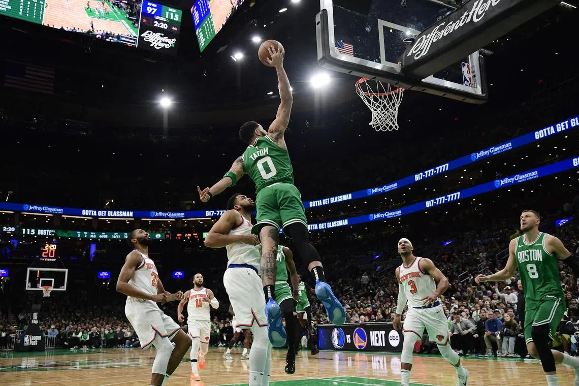 Boston Celtics forward Jayson Tatum tries to dunk the ball during the second half against the New York Knicks at TD Garden. 