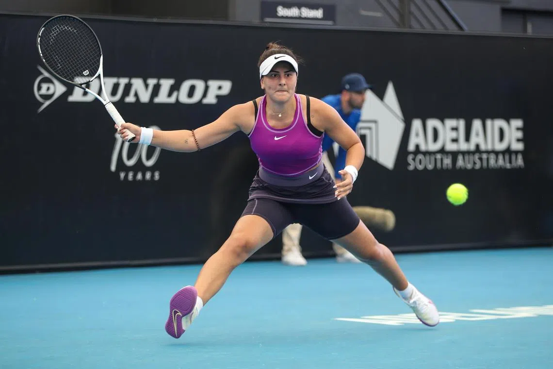 Bianca Andreescu of Canada in action against Garbine Muguruza of Spain during the 2023 Adelaide International Tennis Tournament at the Memorial Drive Tennis Centre in Adelaide, Australia, on Sunday. Andreescu fought back to win 0-6, 7-6 (7-3), 6-1.
