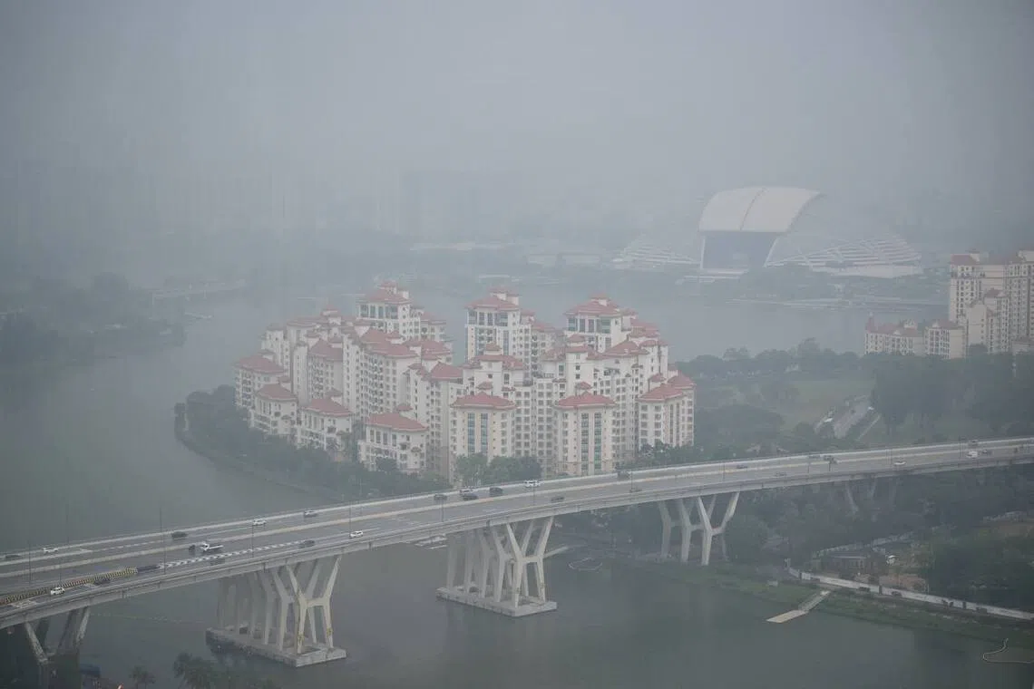 The Singapore skyline shrouded in the haze as seen from the Marina Bay Street Circuit at 5pm on Oct 10.