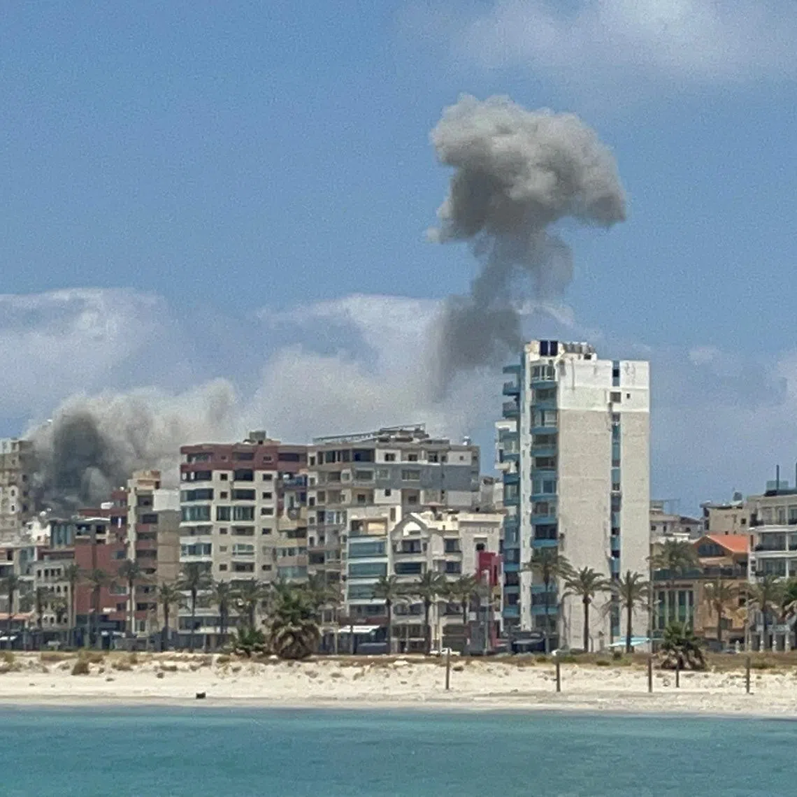 Smoke billows following an Israeli strike in Tyre, Lebanon, June 9, 2026. Picture taken with a mobile phone. REUTERS/Stringer