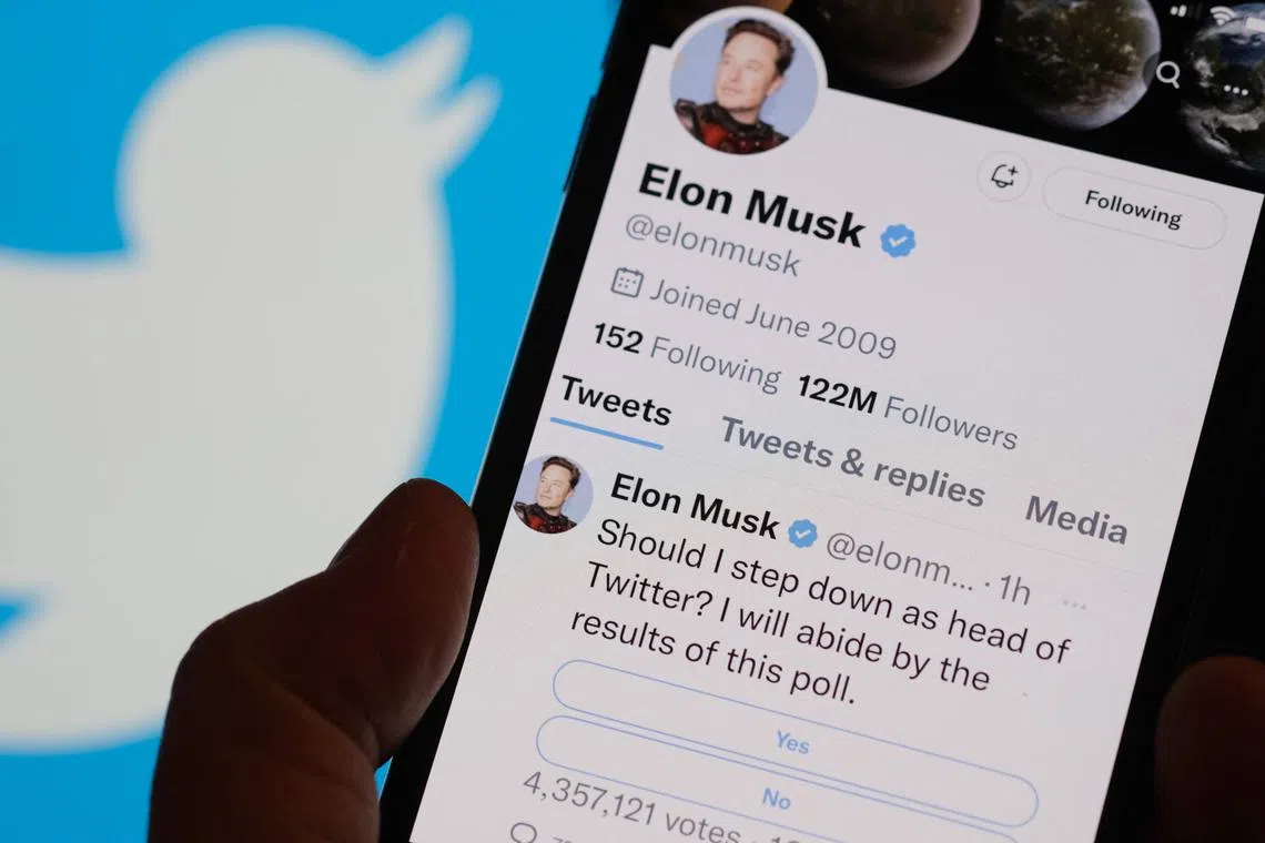 This photo illustration taken on Dec 18 in Los Angeles shows a phone displaying Mr Elon Musk's Twitter page where he is conducting a survey about his future as the head of the company.