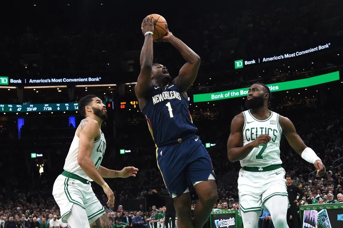 New Orleans Pelicans forward Zion Williamson (centre) shoots the ball during the second half against Boston Celtics on Jan 29.