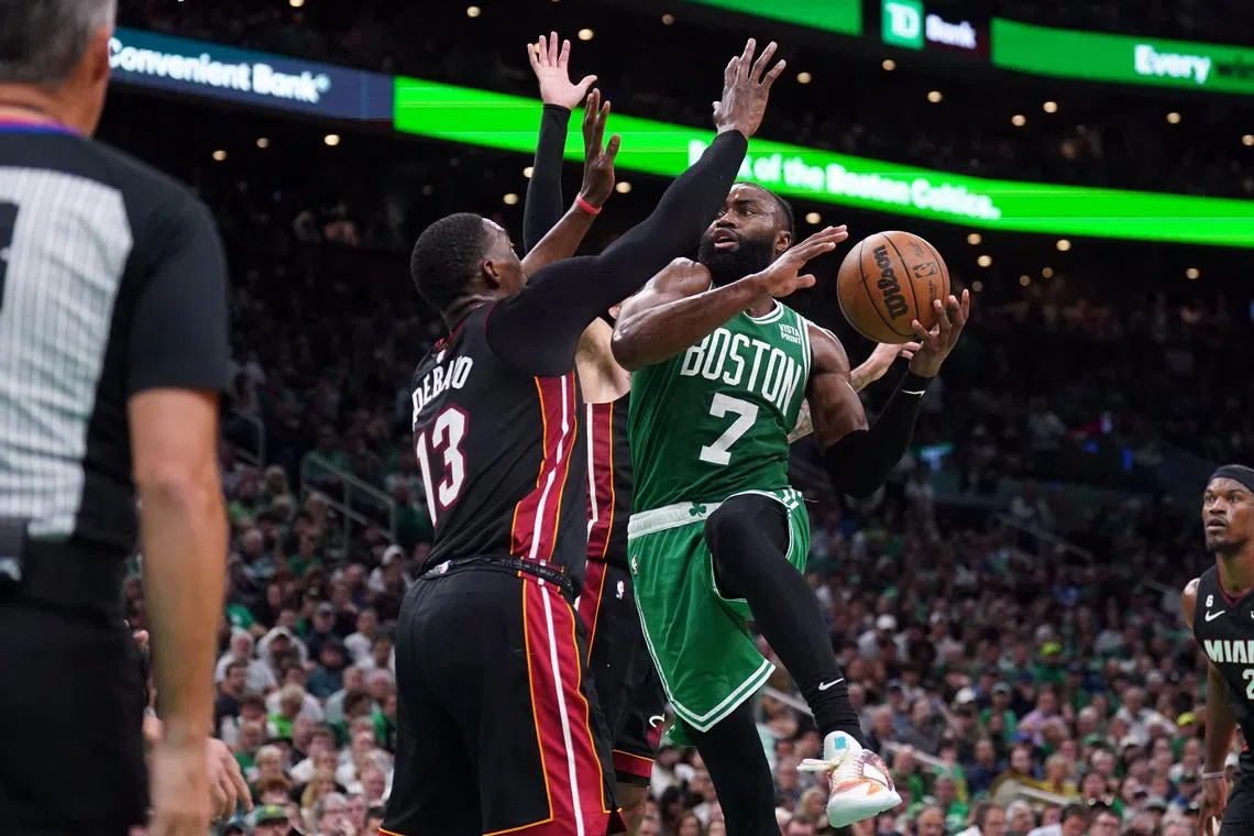 Boston Celtics guard Jaylen Brown shoots against Miami Heat centre Bam Adebayo during Game 7 of the NBA Eastern Conference Finals.