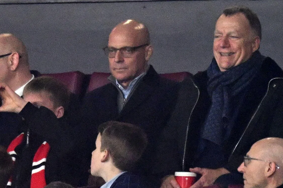 Dave Brailsford (centre) takes his seat for the EPL football match between Manchester United and Aston Villa at Old Trafford in Manchester, on Dec 26.