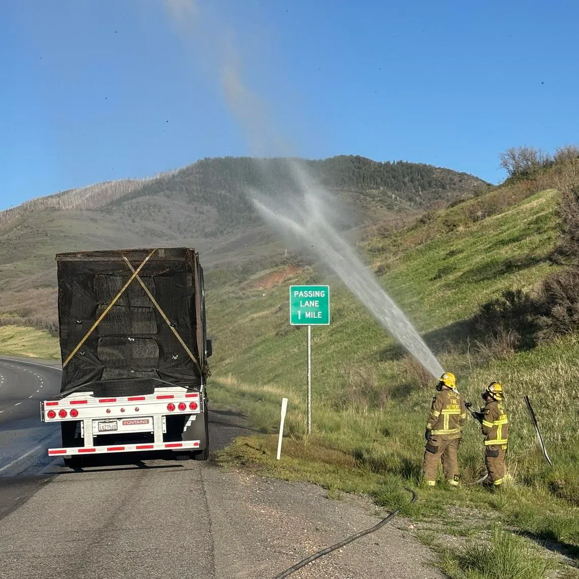 While mechanics worked on the truck, firefighters carefully used a hose to mist the truck’s trailer, which carried 480 hives.