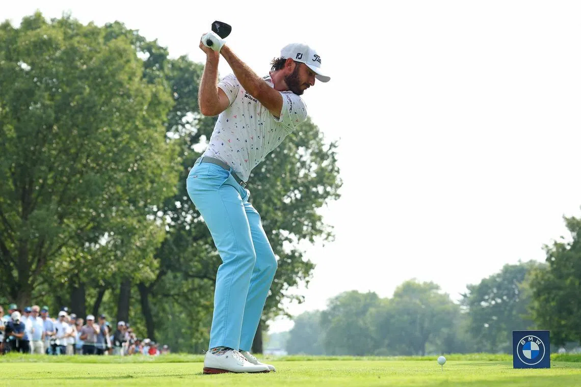 Max Homa of the United States playing a shot from the 18th tee during the second round of the BMW Championship at Olympia Fields Country Club on Friday in Olympia Fields, Illinois.  He set a course record with an eight-under 62 to seize a two-stroke lead.