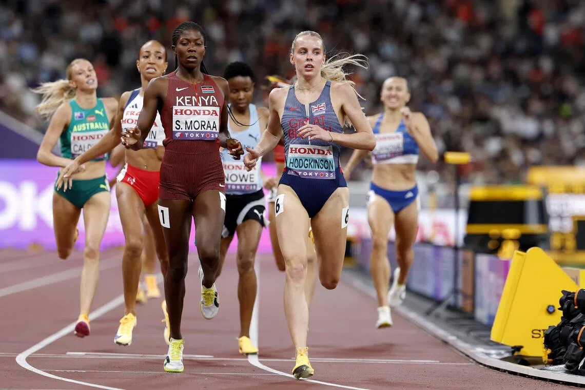 Keely Hodgkinson of Britain and Sarah Moraa of Kenya cross the finish line in the women's 800m semi-final.