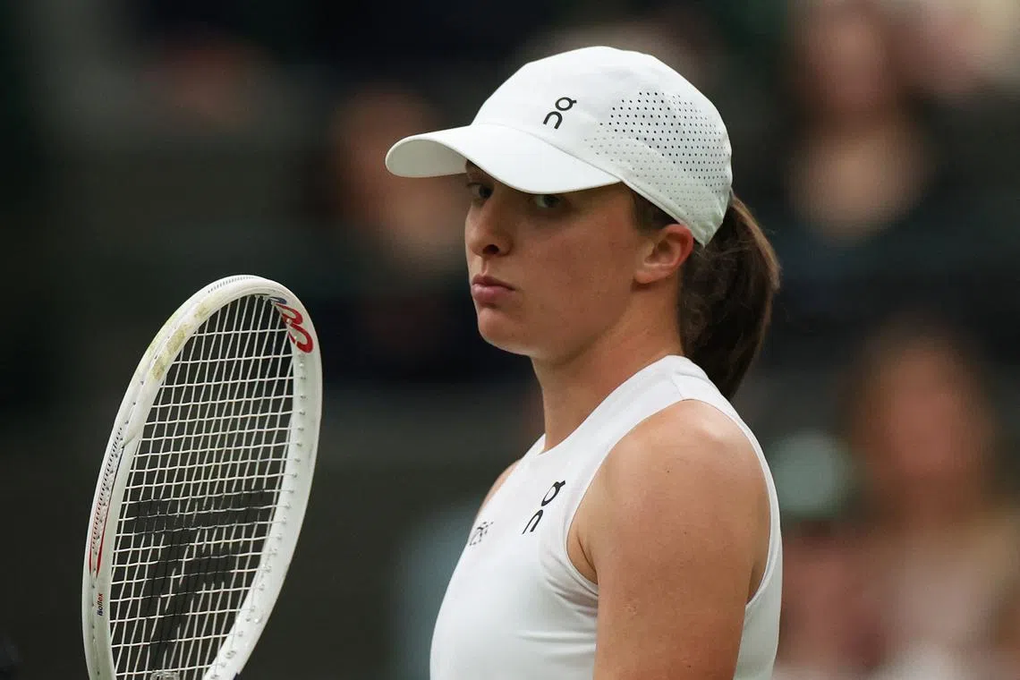 Tennis - Wimbledon - All England Lawn Tennis and Croquet Club, London, Britain - July 6, 2024 Poland's Iga Swiatek reacts during her third round match against Kazakhstan's Yulia Putintseva REUTERS/Isabel Infantes