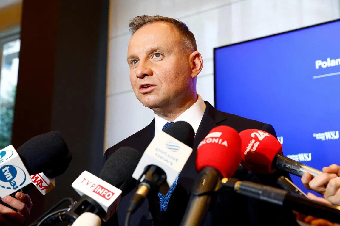 FILE PHOTO: Poland's President Andrzej Duda was reacting to criticism that the law could result in banning opposition politicians from public office.