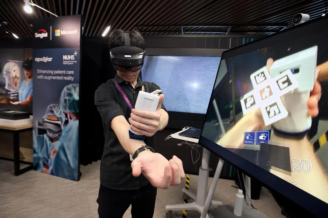 Azure - A doctor from the National Univeristy Health System performing an ultrasound sound scan with the help of AR technology. 

Credit: Singtel