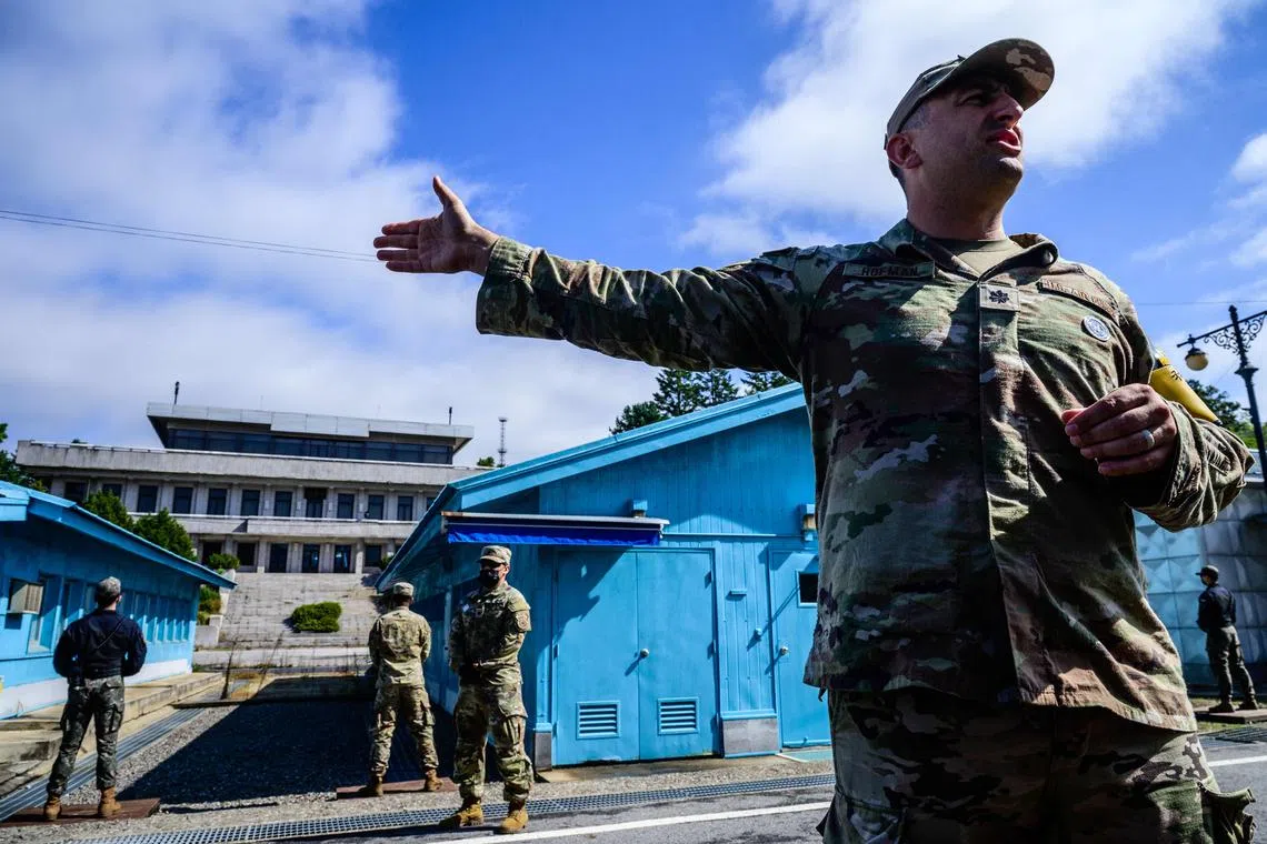 A UN Command soldier provides a media tour at the military demarcation line separating North and South Korea.