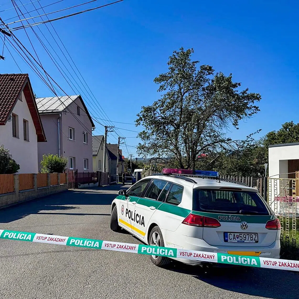 Police guard the entrance to a school in Staskov, north-western Slovakia after a knife attack on Sept 29.