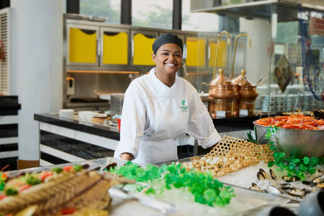 Ms Fizzy Ezlyana Begam enjoys her work as a commis chef, where she helps prepare dishes for the buffet line. 