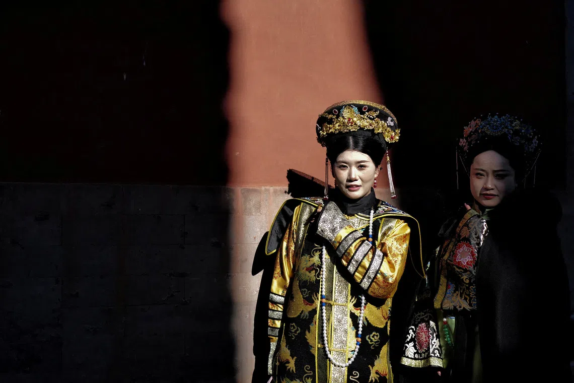 Women dressed up in Chinese traditional costumes visitting the Forbidden City in Beijing, China, on Dec 3, 2025. 