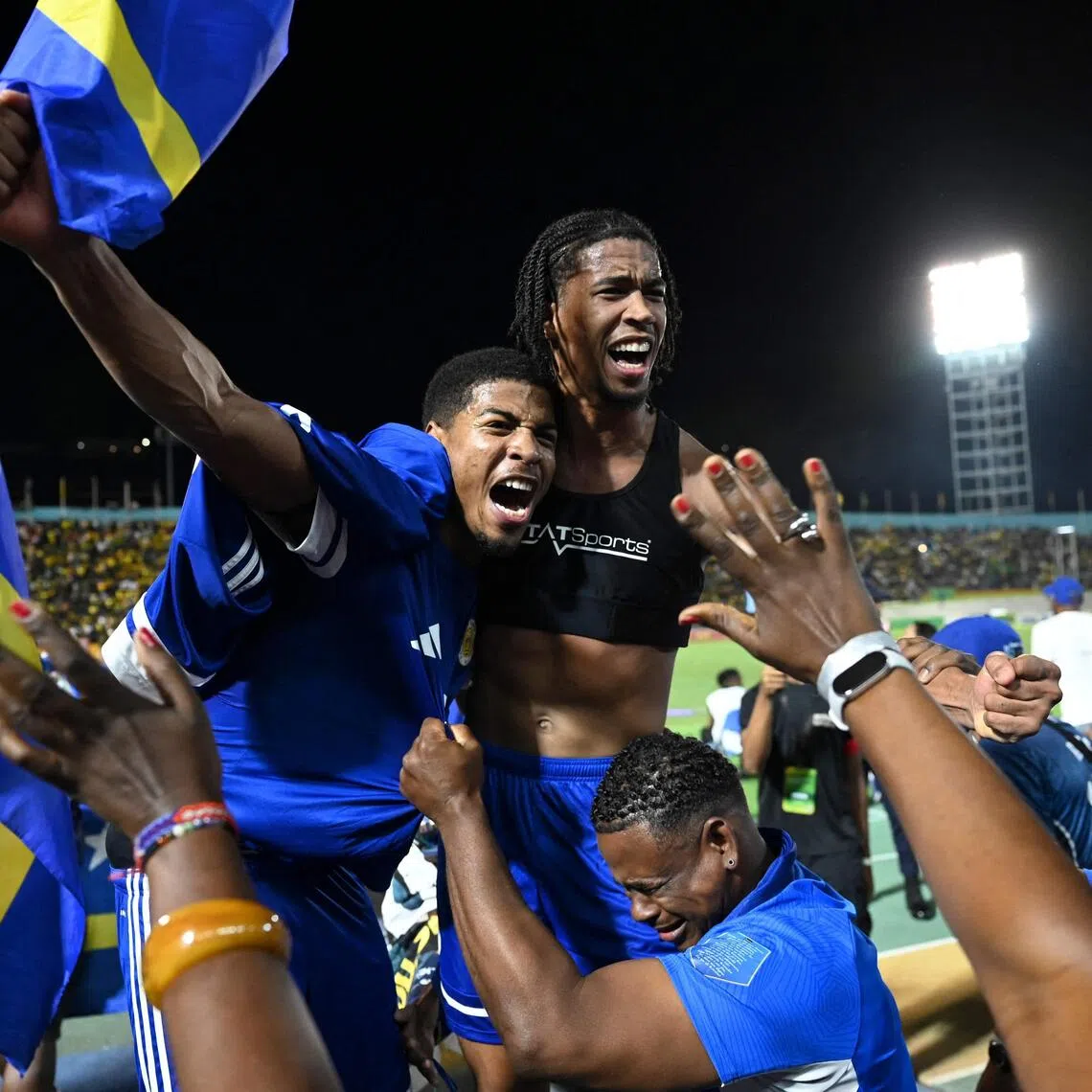 Curacao players and fans celebrating World Cup 2026 qualification after a 0-0 draw with Jamaica at the National Stadium in Kingston, Jamaica on Nov 18, 2025. 