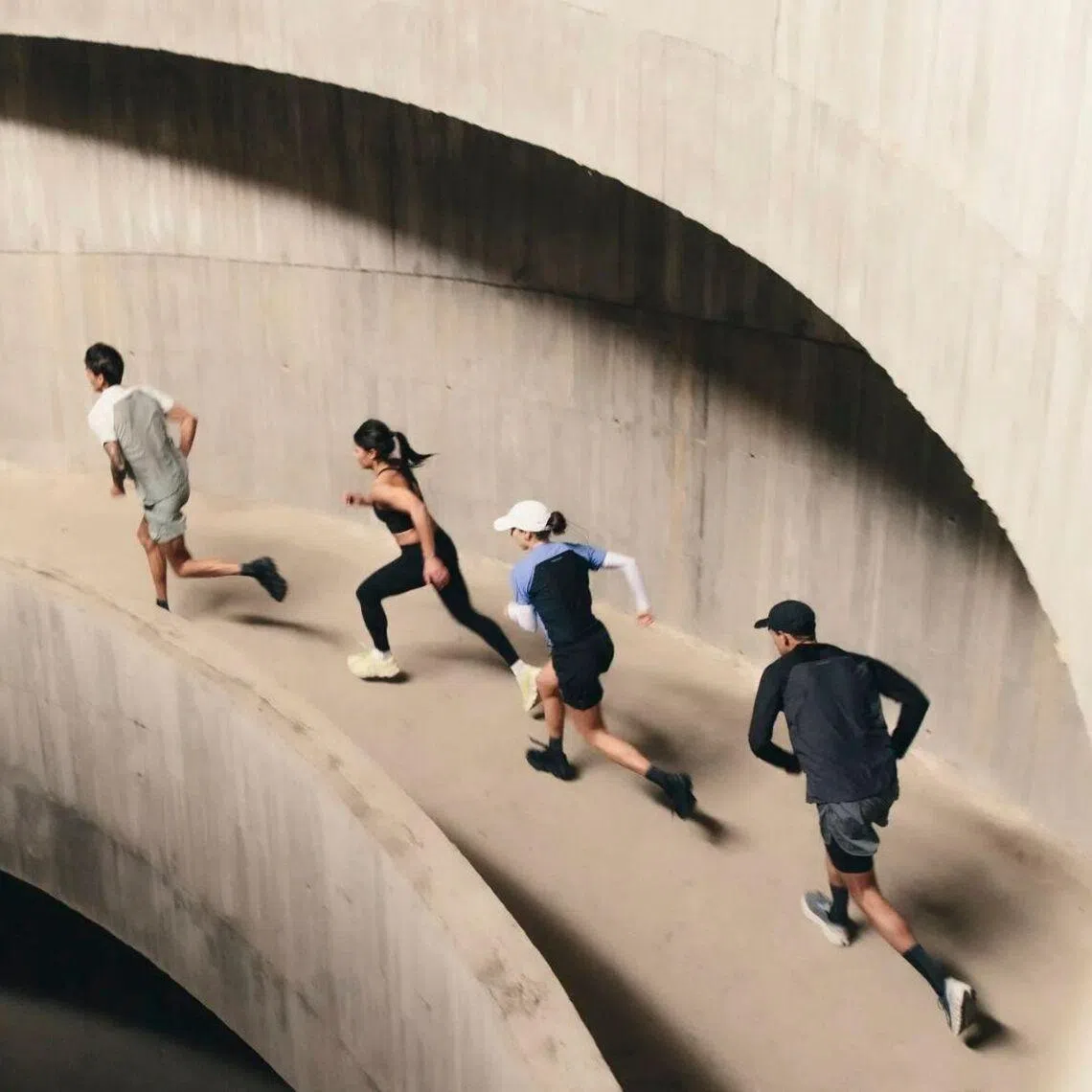 The On Squad Race in Singapore will see runners run down and up two floors of a spiral carpark ramp in teams of four.
