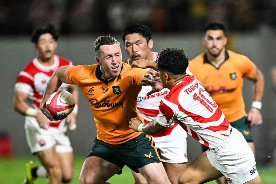 Australia edge out daring Japan 35-32 to give new coach Les Kiss winning start