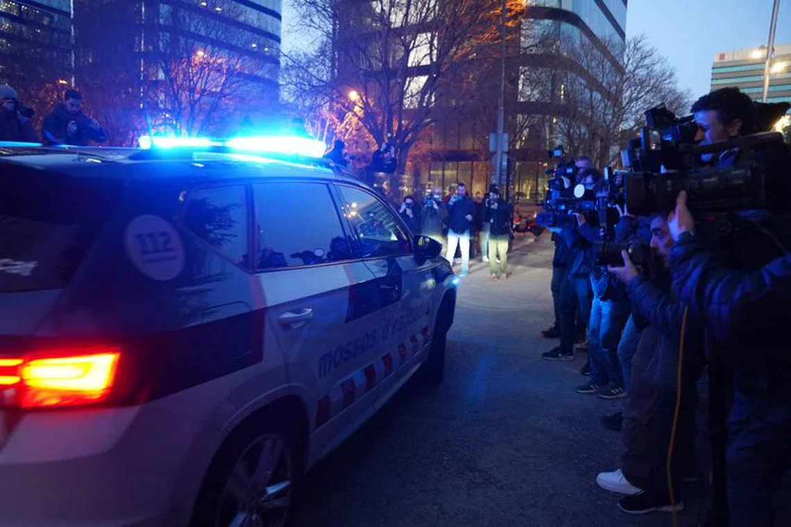Soccer Football - Brazilian soccer player Dani Alves leaves court - Barcelona Court, Barcelona, Spain - January 20, 2023 A police car is seen driving past members of the media leaving Barcelona court after it was reported Dani Alves was jailed on remand REUTERS/Bruna Casas/File Photo