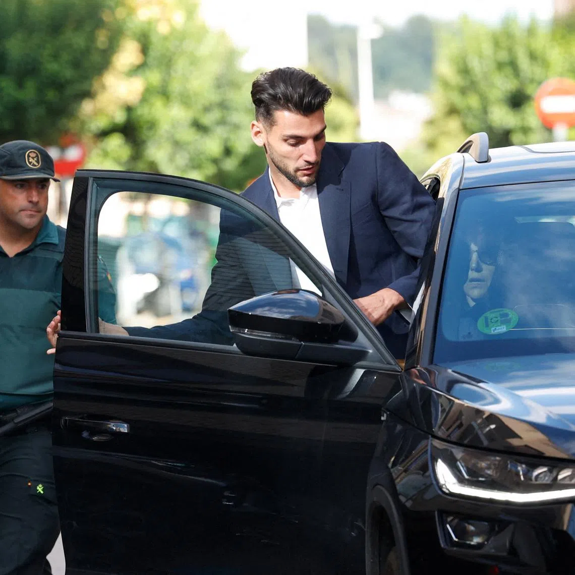 FILE PHOTO: Valencia football player Rafa Mir leaves a Valencia local court after a judge released him with precautionary measures for an alleged crime of sexual assault, in Liria, Spain, September 4, 2024. REUTERS/Eva Manez/File Photo