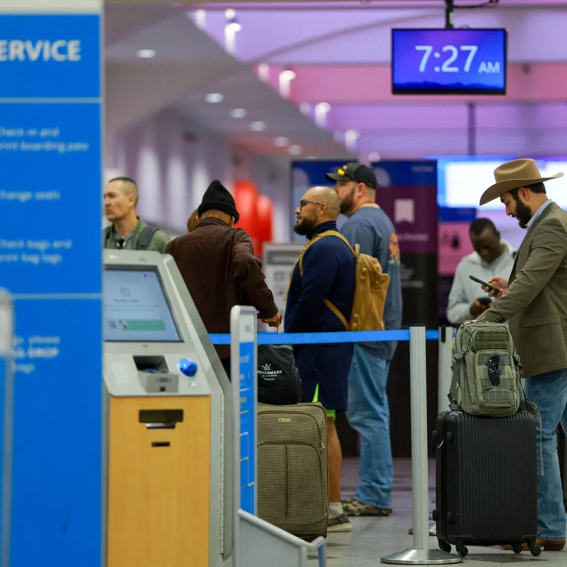 Passengers queue at El Paso International Airport after the U.S. Federal Aviation Administration lifted its temporary closure of the airspace over El Paso, saying all flights will resume as normal and that there was no threat to commercial aviation, in El Paso, Texas, U.S., February 11, 2026. REUTERS/Jose Luis Gonzalez