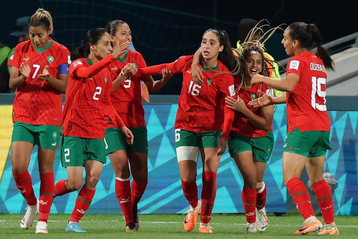 Anissa Lahmari of Morocco is congratulated by teammates after scoring in the 1-0 Women's World Cup win over Colombia.