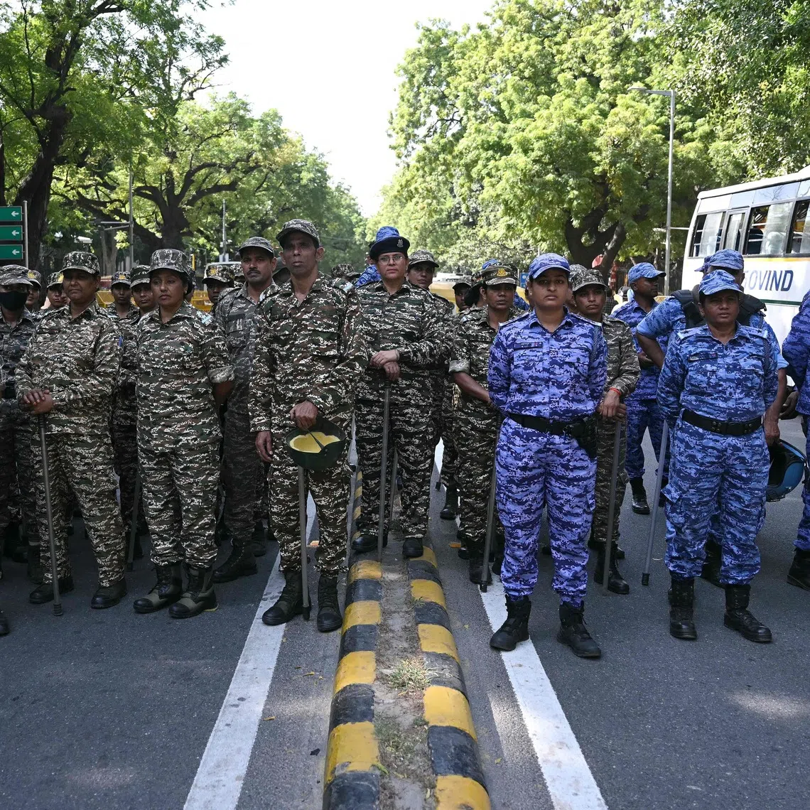 Police and security personnel assemble near the Election Commission of India office in New Delhi on Oct 6.
